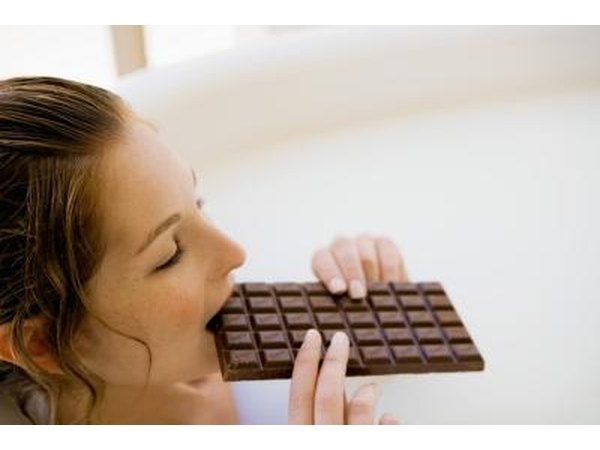woman eating chocolate bar
