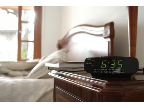 Alarm clock next to bed.