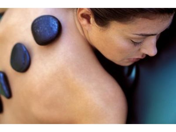 Woman getting stone massage