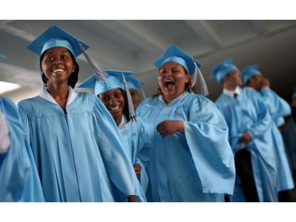 High school graduates laughing