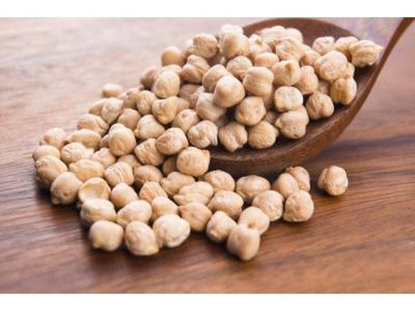 Wooden spoonful of chickpeas.