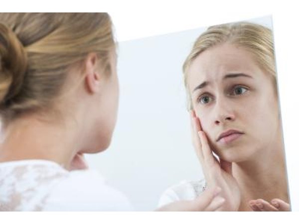 girl looking at skin