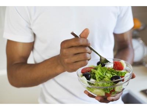 man eating salad