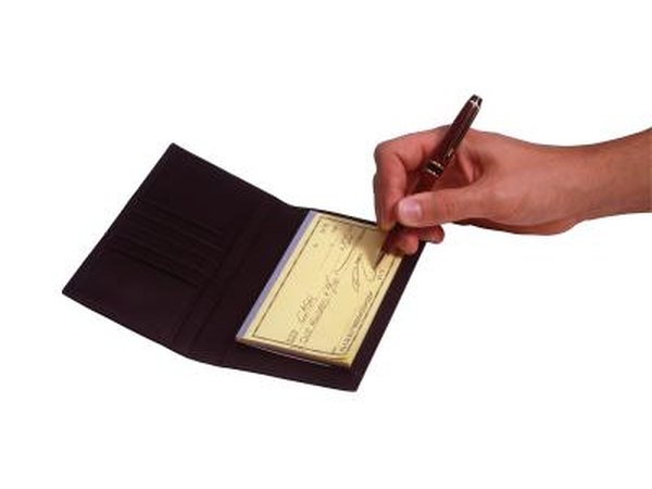 Writing a personal check.