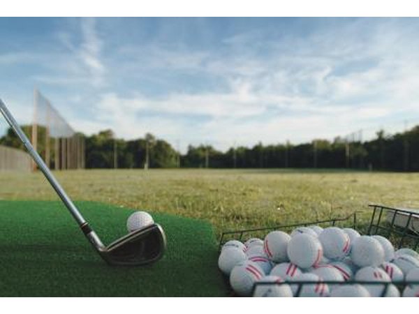 Golf club and bucket of balls