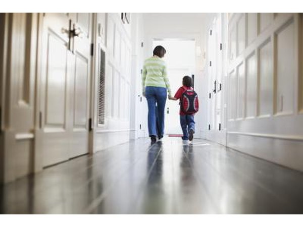 Mother and son walking in hallway