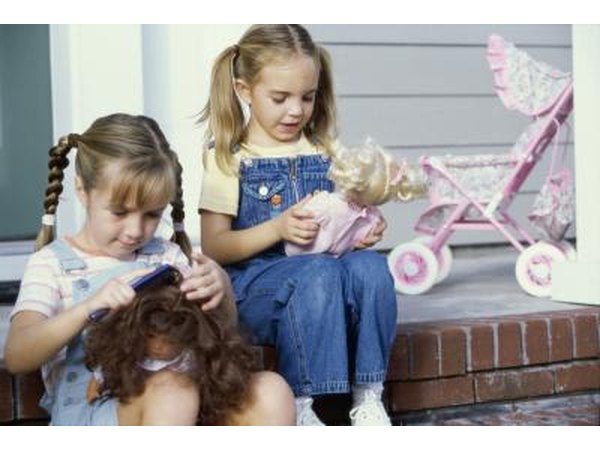 Girls playing with dolls