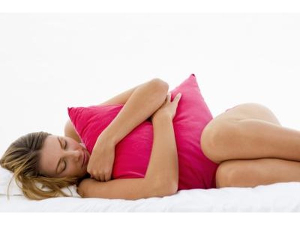 Woman hugging pillow