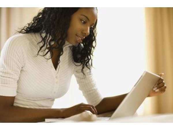 Woman looking at laptop