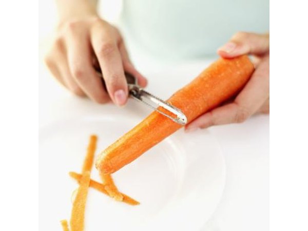 Woman preparing a carrot