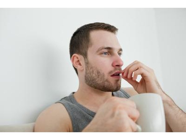 male taking a pill