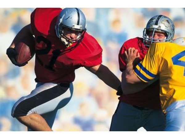 American football players usually use their hands to pass, catch and carry the ball