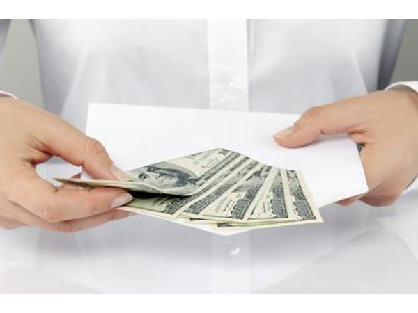 Woman taking money out of envelope