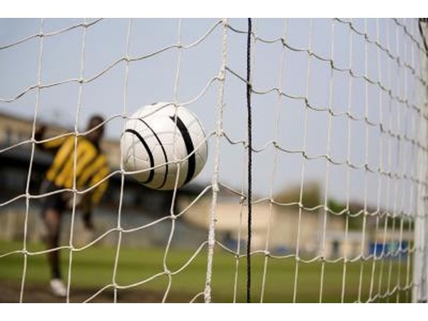 In soccer, a team can only score by kicking the ball into the opponent's goal