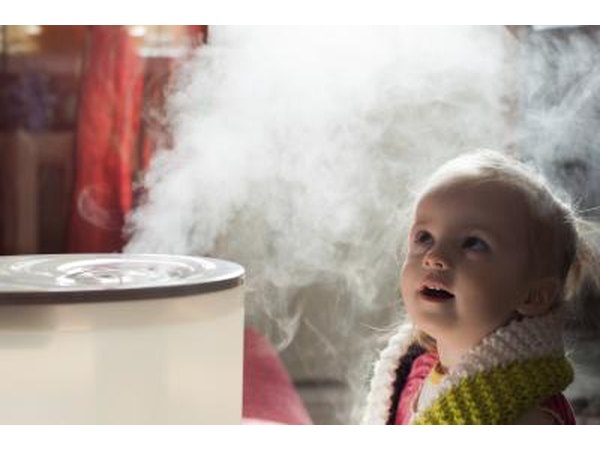 Young child next to humidifier