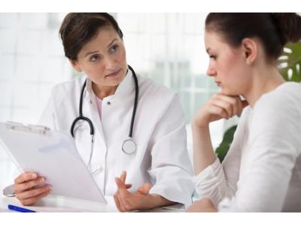 general practice doctor speaking with patient