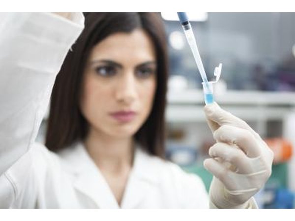 Scientist taking sample in lab