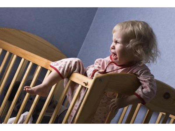 Uncomfortable infant in crib.