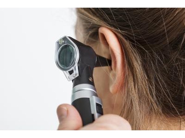 An otoscope is used by a doctor to examine the ear.