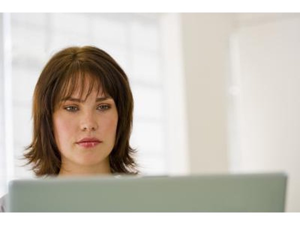 Woman reading on laptop