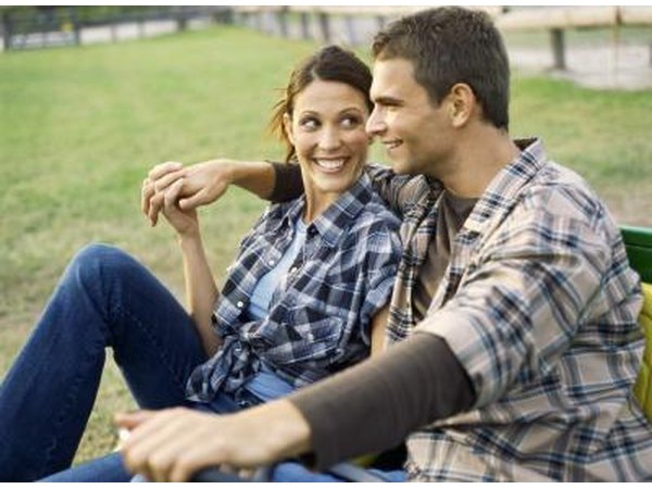 Couple holding hands on farm