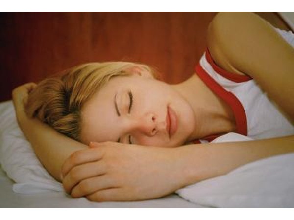 A woman sleep on her arm.