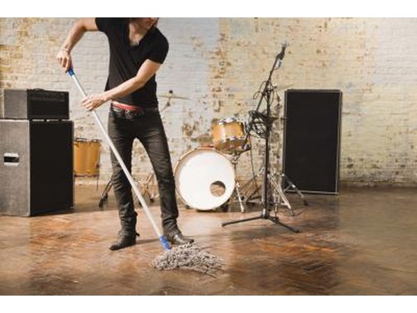 Runner cleaning up floor on stage