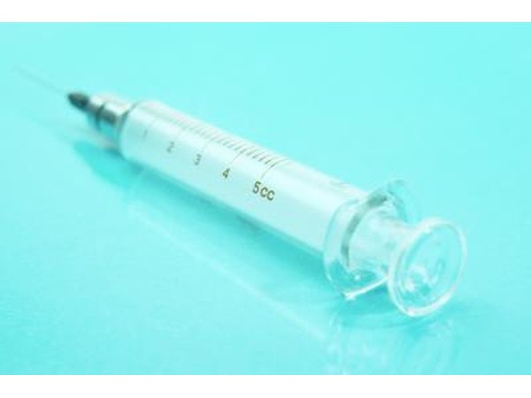 A bulb syringe with baking soda and water used properly can help relieve plugged ears.