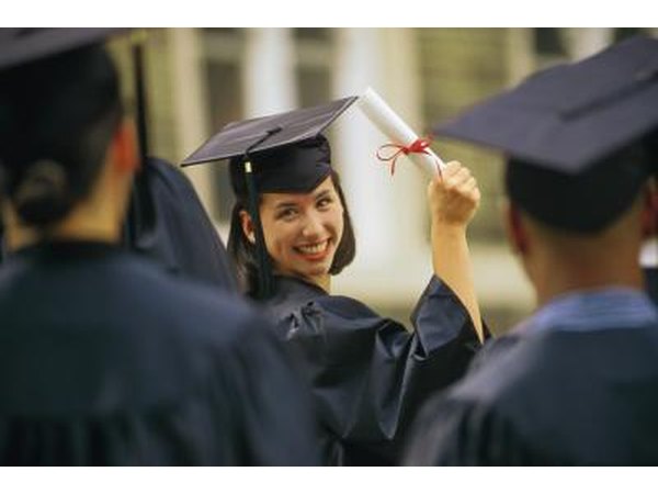woman on graduation day holding degree