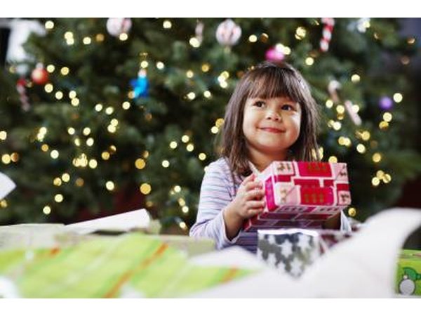 Young girl holding Christmas present