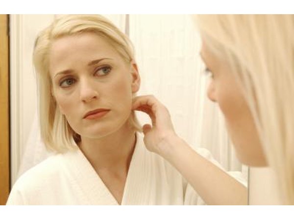 Woman looking in mirror