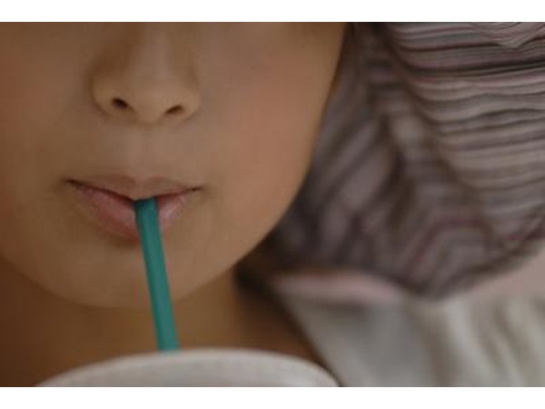 woman using straw