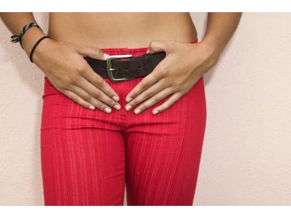 Woman holding hands on belt