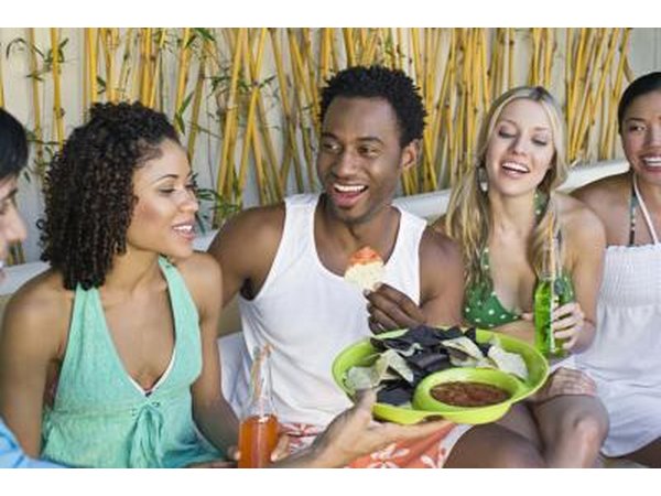 Friends talking at party