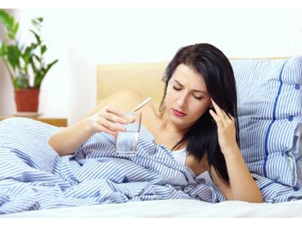 sick woman drinking water