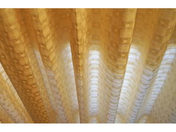 Yellow curtain with shadows.
