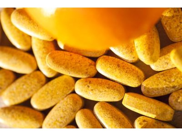 Vitamin C pills and orange