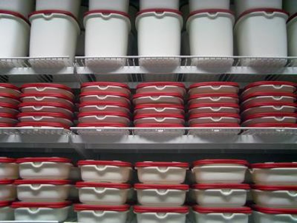 Plastic containers on shelves