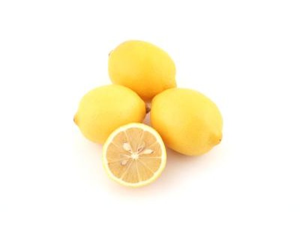 Whole lemons and a cut lemon.