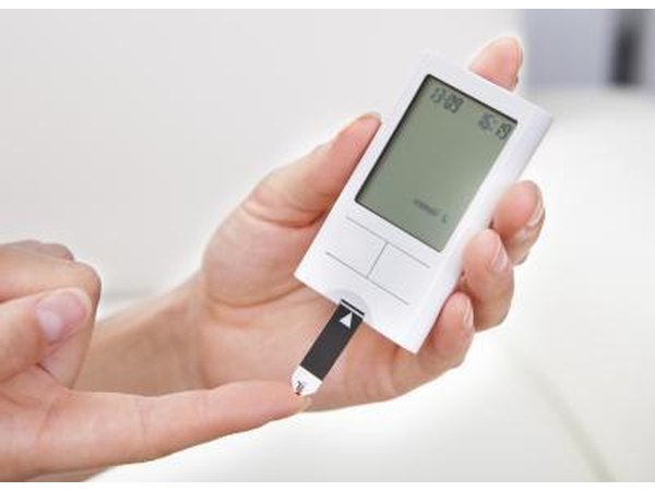 Woman testing her blood sugar level