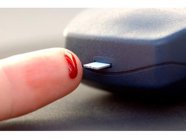Woman testing blood sugar levels