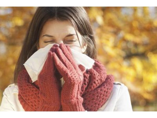 woman blowing her nose