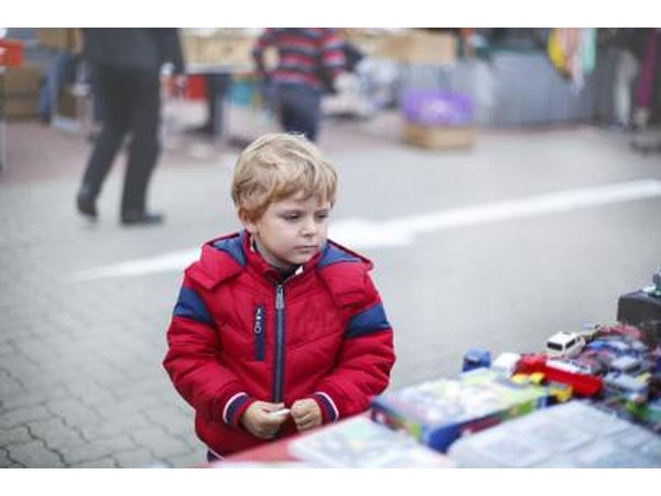 child at outdoor flea market