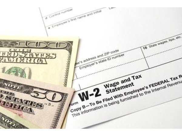 Money with W-2 forms.