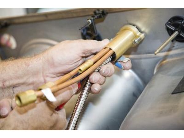 water lines beneath sink