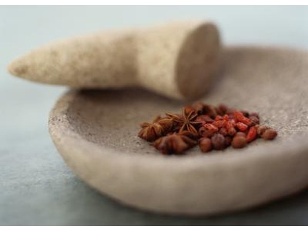 Use a mortar and pestle to crush pills