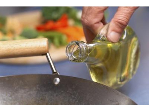 Pouring safflower oil into sauce pan