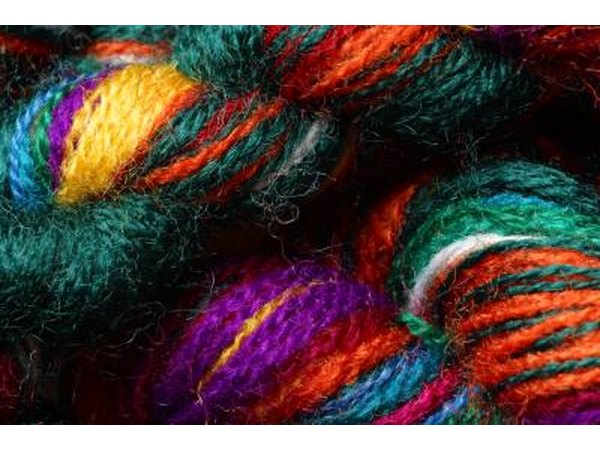Fill the hamper with different colored, good-quality yarn, knitting needles and book of new patterns.