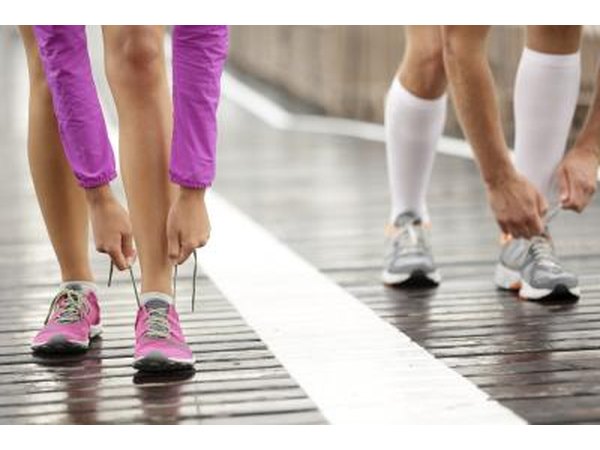 Runners tie shoelaces