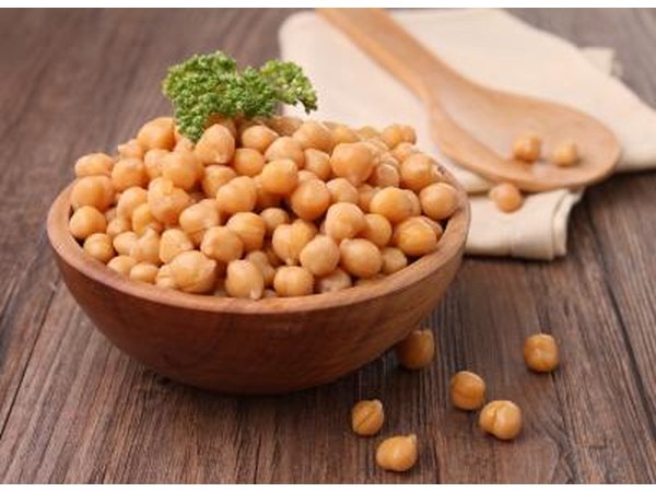 A wooden bowl of chickpeas.